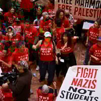 Demonstrators from the anti-Israel Jewish Voice for Peace protest inside Trump Tower in support of Columbia graduate student Mahmoud Khalil, Thursday, March 13, 2025, in New York. (AP Photo/Yuki Iwamura)