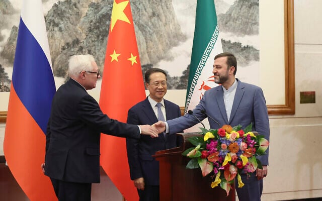 From left, Russian Deputy Foreign Minister Sergei Ryabkov, Chinese Vice Foreign Minister Ma Zhaoxu and Iranian Deputy Foreign Minister Kazem Gharibabadi, meet with reporters after their meeting at Diaoyutai State Guest House on March 14, 2025 in Beijing, China. (Lintao Zhang/Pool Photo via AP) From left, Russian Deputy Foreign Minister Sergei Ryabkov, Chinese Vice Foreign Minister Ma Zhaoxu and Iranian Deputy Foreign Minister Kazem Gharibabadi, meet with reporters after their meeting at Diaoyutai State Guest House on March 14, 2025 in Beijing, China. (Lintao Zhang/Pool Photo via AP)