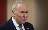 Senate Democratic Leader Chuck Schumer gives a television interview, at the Capitol in Washington, March 14, 2025. (AP Photo/Ben Curtis)