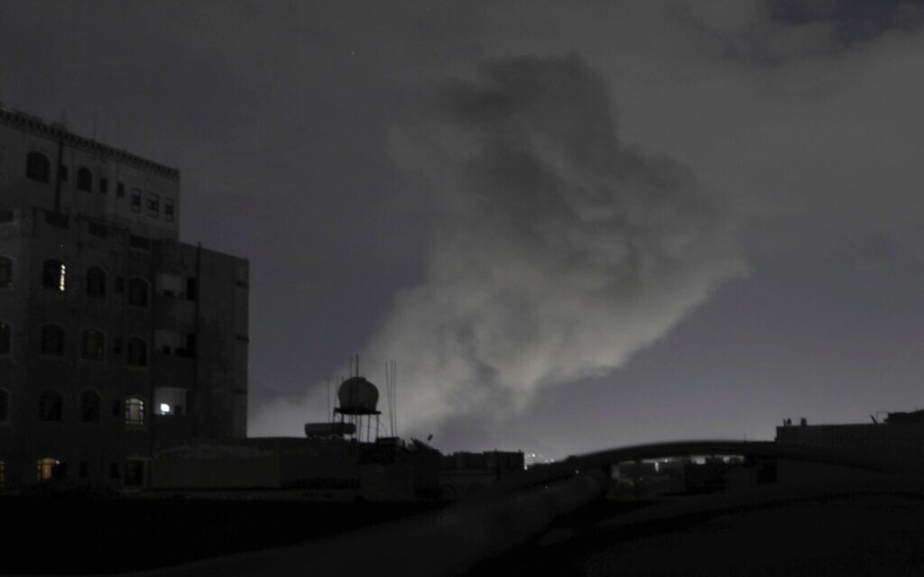 Smoke rises from a location reportedly struck by US airstrikes in Sanaa, Yemen, March 15, 2025. (AP Photo/Osamah Abdulrahman)