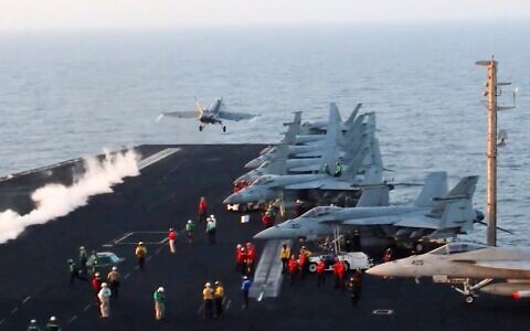 This image taken from video provided by the US Navy shows an aircraft launching from the USS Harry S. Truman in the Red Sea before airstrikes in Sanaa, Yemen, March 15, 2025. (US Navy via AP)