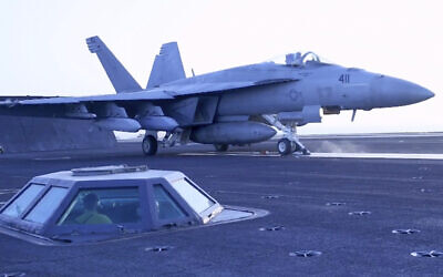 This image taken from video provided by the US Navy shows an aircraft launching from the USS Harry S. Truman in the Red Sea before airstrikes in Sanaa, Yemen, March 15, 2025. (US Navy via AP)