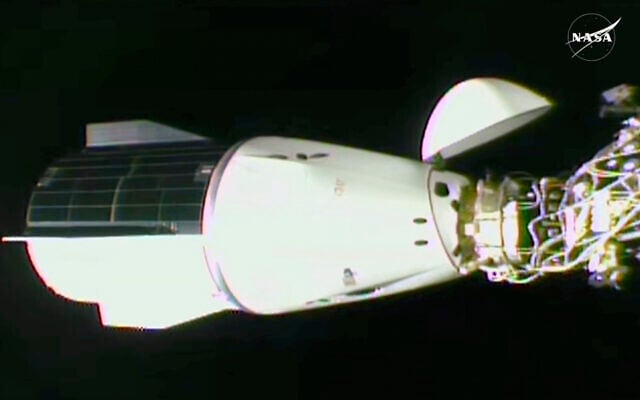 This image made from video by NASA shows the docking of the SpaceX capsule to the International Space Station Sunday, March 16, 2025. (NASA via AP) This image made from video by NASA shows the docking of the SpaceX capsule to the International Space Station Sunday, March 16, 2025. (NASA via AP)