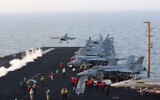 This image taken from video provided by the US Navy shows an aircraft launching from the USS Harry S. Truman in the Red Sea before airstrikes in Sanaa, Yemen, March 15, 2025. (US Navy via AP)
