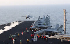 This image taken from video provided by the US Navy shows an aircraft launching from the USS Harry S. Truman in the Red Sea before airstrikes in Sanaa, Yemen, March 15, 2025. (US Navy via AP)