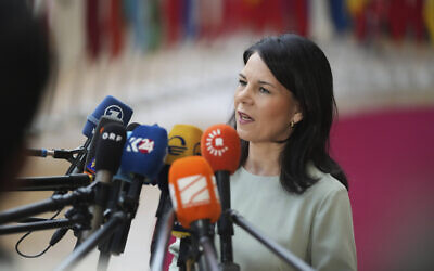 Germany's Foreign Minister Annalena Baerbock speaks with the media as she arrives for a meeting of EU foreign ministers at the European Council building in Brussels, Monday, March 17, 2025. (AP Photo/Virginia Mayo)