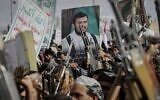 Houthi supporters chant slogans and hold pictures of Abdul Malik al-Houthi, the leader of the Houthi movement, during an anti-US and anti-Israel rally in Sanaa, Yemen, March 17, 2025. (AP Photo/Osamah Abdulrahman)