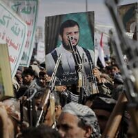 Houthi supporters chant slogans and hold pictures of Abdul Malik al-Houthi, the leader of the Houthi movement, during an anti-US and anti-Israel rally in Sanaa, Yemen, March 17, 2025. (AP Photo/Osamah Abdulrahman)
