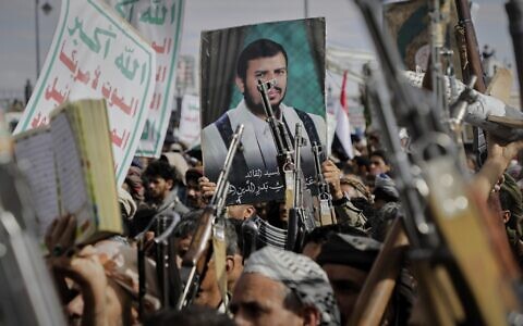 Houthi supporters chant slogans and hold pictures of Abdul Malik al-Houthi, the leader of the Houthi movement, during an anti-US and anti-Israel rally in Sanaa, Yemen, March 17, 2025. (AP Photo/Osamah Abdulrahman)