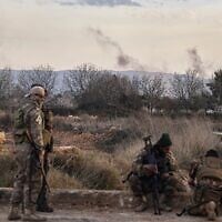 Syrian troops take position in the village of Hawsh al-Sayyid Ali, located 2 km (1.24 miles) from the Lebanon border, Syria, March 17, 2025. (AP Photo/Omar Albam)