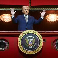 US President Donald Trump stands in the presidential box as he tours the John F. Kennedy Center for the Performing Arts in Washington, Monday, March 17, 2025. (Pool via AP)