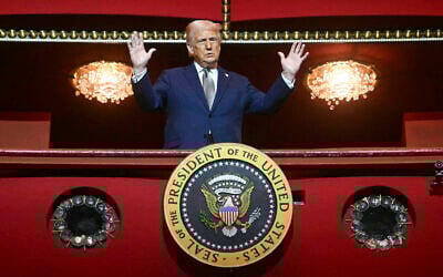 US President Donald Trump stands in the presidential box as he tours the John F. Kennedy Center for the Performing Arts in Washington, Monday, March 17, 2025. (Pool via AP)