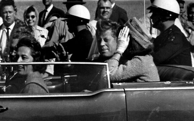 US President John F. Kennedy waves from his car in a motorcade approximately one minute before he was shot, in Dallas, November 22, 1963. Riding with President Kennedy are first lady Jacqueline Kennedy, right, Nellie Connally, second from left, and her husband, Texas Gov. John Connally, far left. (Jim Altgens/AP) US President John F. Kennedy waves from his car in a motorcade approximately one minute before he was shot, in Dallas, November 22, 1963. Riding with President Kennedy are first lady Jacqueline Kennedy, right, Nellie Connally, second from left, and her husband, Texas Gov. John Connally, far left. (Jim Altgens/AP)