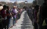Syrian men pray during the funeral of Muhannad Akrad, one of three people killed in Israeli airstrikes on Monday, at the Omary mosque in Daraa, southern Syria, March 18, 2025. (AP Photo/Omar Sanadiki)