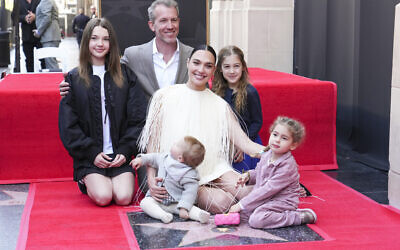 Alma Varsano, from left, Jaron Varsano, Ori Varsano, Gal Gadot, Maya Varsano, and Daniella Varsano pose with Gadot's new star during a ceremony on the Hollywood Walk of Fame on Tuesday, March 18, 2025, in Los Angeles. (Photo by Jordan Strauss/Invision/AP)
