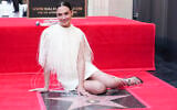 Gal Gadot poses with her new star at a ceremony honoring her on the Hollywood Walk of Fame on March 18, 2025, in Los Angeles. (Jordan Strauss/Invision/AP)