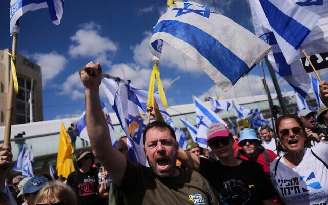 Israelis march in a protest against Prime Minister Benjamin Netanyahu and his plans to dismiss the head of the Shin Bet internal security service, in Jerusalem on March 19, 2025. (AP Photo/Ohad Zwigenberg)