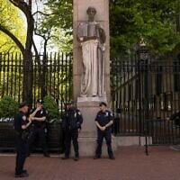 Police officers stand guard outside Columbia University, May 2, 2024, in New York. (AP Photo/Yuki Iwamura)