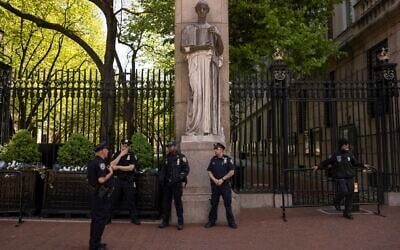 Police officers stand guard outside Columbia University, May 2, 2024, in New York. (AP Photo/Yuki Iwamura)