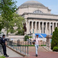 A New York City police officer keeps watch on the campus of Columbia University in New York, Monday, May 6, 2024.  (AP/Seth Wenig)