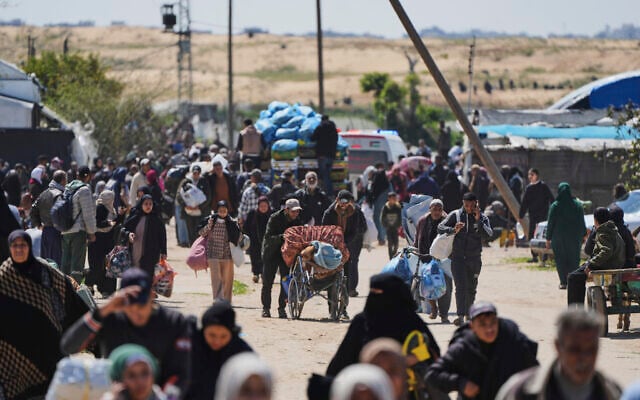 Displaced Palestinians, fleeing the city of Rafah amid ongoing Israeli military operations, arrive in Khan Younis, Gaza, on March 23, 2025. (AP/Abdel Kareem Hana) Displaced Palestinians, fleeing the city of Rafah amid ongoing Israeli military operations, arrive in Khan Younis, Gaza, on March 23, 2025. (AP/Abdel Kareem Hana)