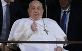 Pope Francis makes a thumbs-up gesture as he appears at a window of the Agostino Gemelli Polyclinic in Rome, March 23, 2025, where he has been treated for bronchitis and bilateral pneumonia since February 14. (AP Photo/Domenico Stinellis)