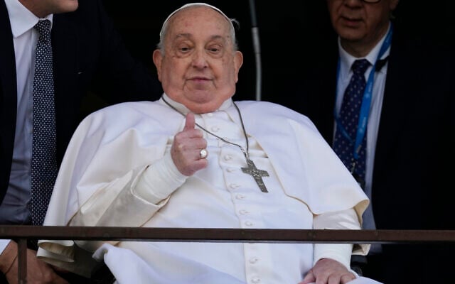 Pope Francis makes a thumbs-up gesture as he appears at a window of the Agostino Gemelli Polyclinic in Rome, March 23, 2025, where he has been treated for bronchitis and bilateral pneumonia since February 14. (AP Photo/Domenico Stinellis) Pope Francis makes a thumbs-up gesture as he appears at a window of the Agostino Gemelli Polyclinic in Rome, March 23, 2025, where he has been treated for bronchitis and bilateral pneumonia since February 14. (AP Photo/Domenico Stinellis)