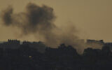 Smoke rises after an explosion in the Gaza Strip as seen from southern Israel, March 23, 2025. (AP Photo/Leo Correa)