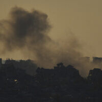 Smoke rises after an explosion in the Gaza Strip as seen from southern Israel, March 23, 2025. (AP Photo/Leo Correa)