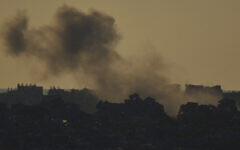 Smoke rises after an explosion in the Gaza Strip as seen from southern Israel, March 23, 2025. (AP Photo/Leo Correa)