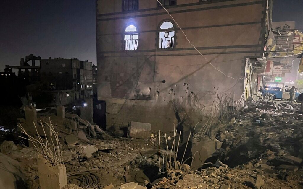 A Yemeni checks debris at his home after US airstrikes in Sanaa, Yemen, March 24, 2025. (AP Photo)