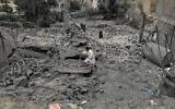 A Yemeni walks over the debris of a destroyed building following US airstrikes in Sanaa, Yemen, March 24, 2025. (AP)