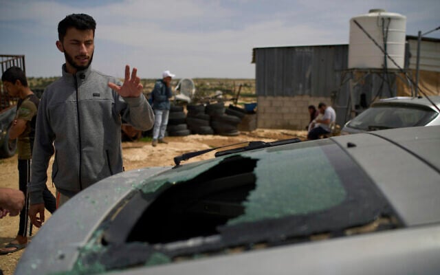 Basel Adra, Palestinian co-director of the Oscar winner documentary "No Other Land", looks at the damaged car of the Palestinian co-director Hamdan Ballal, who was wounded in clashes with settlers before being detained by the army in theWest Bank village of Susiya on Tuesday, March 25, 2025. (AP Photo/Leo Correa) Basel Adra, Palestinian co-director of the Oscar winner documentary "No Other Land", looks at the damaged car of the Palestinian co-director Hamdan Ballal, who was wounded in clashes with settlers before being detained by the army in theWest Bank village of Susiya on Tuesday, March 25, 2025. (AP Photo/Leo Correa)