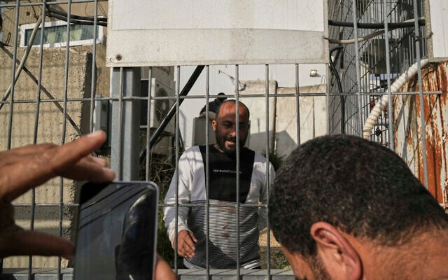 Hamdan Ballal, Oscar-winning Palestinian director of 'No Other Land,' is released from a police station in the West Bank settlement of Kiryat Arba a day after being detained by the Israeli army following an alleged attack by Jewish settlers, March 25, 2025. (AP Photo/Leo Correa) Hamdan Ballal, Oscar-winning Palestinian director of 'No Other Land,' is released from a police station in the West Bank settlement of Kiryat Arba a day after being detained by the Israeli army following an alleged attack by Jewish settlers, March 25, 2025. (AP Photo/Leo Correa)