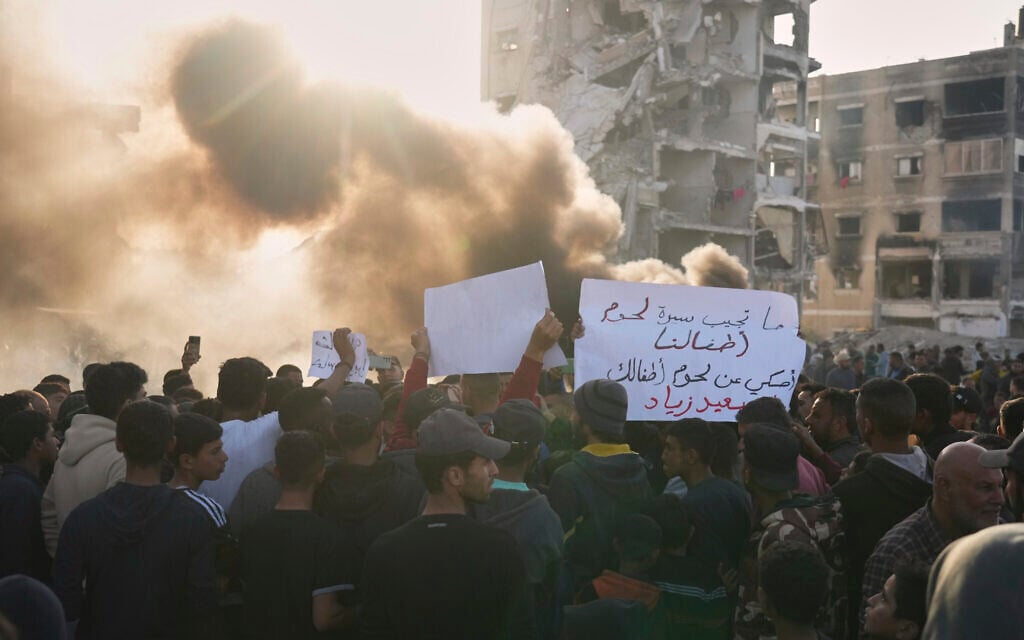 Palestinians chant slogans during an anti-Hamas and anti-war protest, in Beit Lahia in the northern Gaza Strip, Wednesday, March 26, 2025. (AP Photo/Jehad Alshrafi)