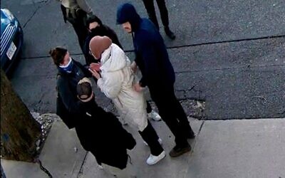 In this image taken from security camera video, Rumeysa Ozturk, a 30-year-old doctoral student at Tufts University, is detained by Department of Homeland Security agents on a street in Somerville, Massachusetts, March 26, 2025. (AP Photo)