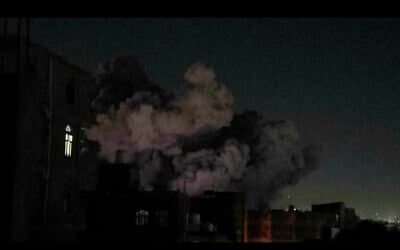 In this image made from video, smoke rises after a blast in Sanaa, Yemen, Friday, March 28, 2025. (AP Photo)