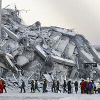 Rescuers work at the site a high-rise building under construction that collapsed after a 7.7 magnitude earthquake in Bangkok, Thailand, Friday, March 28, 2025. (AP Photo/Wason Wanichakorn)