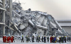 Rescuers work at the site a high-rise building under construction that collapsed after a 7.7 magnitude earthquake in Bangkok, Thailand, Friday, March 28, 2025. (AP Photo/Wason Wanichakorn)