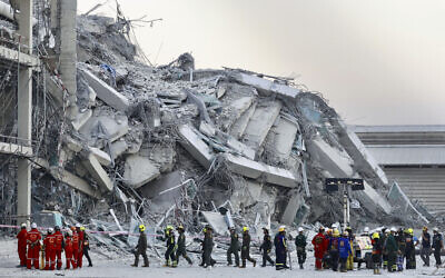 Rescuers work at the site a high-rise building under construction that collapsed after a 7.7 magnitude earthquake in Bangkok, Thailand, Friday, March 28, 2025. (AP Photo/Wason Wanichakorn)