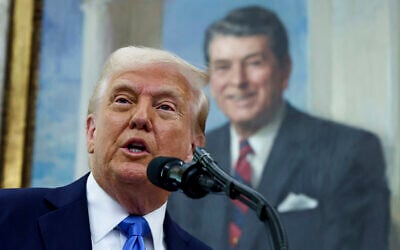US President Donald Trump speaks during a swearing in ceremony for Alina Habba as interim US Attorney General for New Jersey, in the Oval Office of the White House in Washington, Friday, March 28, 2025. (Pool via AP)
