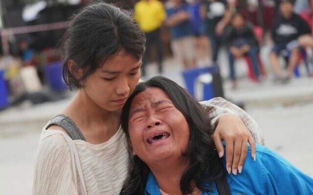 A woman reacts after being informed that her husband had died at the site of a collapsed under construction high-rise building in Bangkok, Thailand, March 30, 2025. (AP Photo/Sakchai Lalit) A woman reacts after being informed that her husband had died at the site of a collapsed under construction high-rise building in Bangkok, Thailand, March 30, 2025. (AP Photo/Sakchai Lalit)