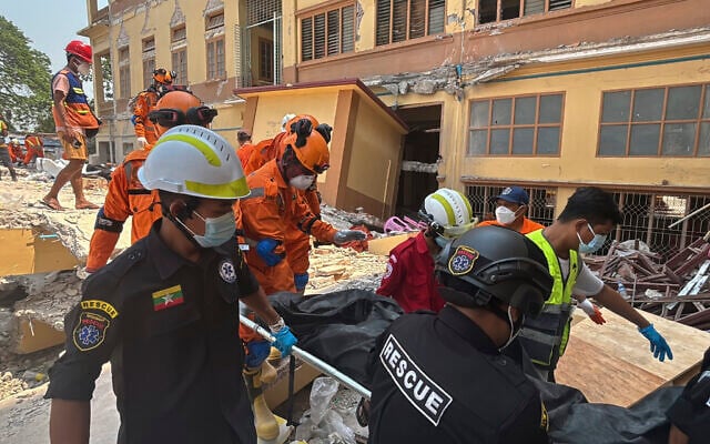 Indian and Myanmar rescuers at U Hla Thein Buddhist monastery that collapsed in Friday's earthquake in Mandalay, Myanmar, Monday, March 31, 2025. (AP Photo) Indian and Myanmar rescuers at U Hla Thein Buddhist monastery that collapsed in Friday's earthquake in Mandalay, Myanmar, Monday, March 31, 2025. (AP Photo)