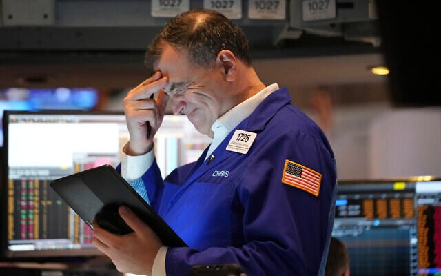 A person works on the floor at the New York Stock Exchange in New York, March 31, 2025. (AP Photo/Seth Wenig) A person works on the floor at the New York Stock Exchange in New York, March 31, 2025. (AP Photo/Seth Wenig)