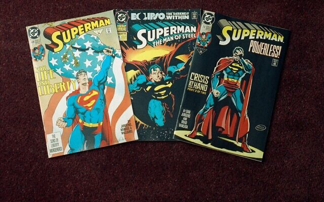 An undated photo shows three editions of the 'Superman' comic book. (AP Photo/ Ed Bailey)