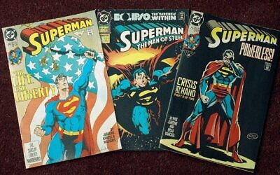 An undated photo shows three editions of the 'Superman' comic book. (AP Photo/ Ed Bailey)