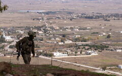 An IDF soldier is seen at a former Syrian Army post at Tel Kwdana, Syria, December 11, 2024. (Emanuel Fabian/Times of Israel)