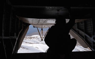 An Israeli Air Force helicopter prepares to land in the Mount Hermon area in southern Syria, March 11, 2025. (Emanuel Fabian/Times of Israel)