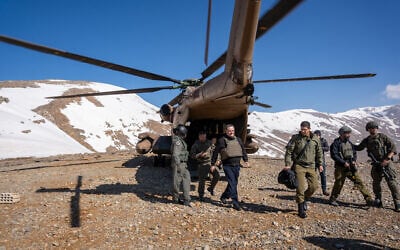 Defense Minister Israel Katz (center) gets off an Israeli Air Force helicopter in the Mount Hermon area in southern Syria, March 11, 2025. (Emanuel Fabian/Times of Israel)