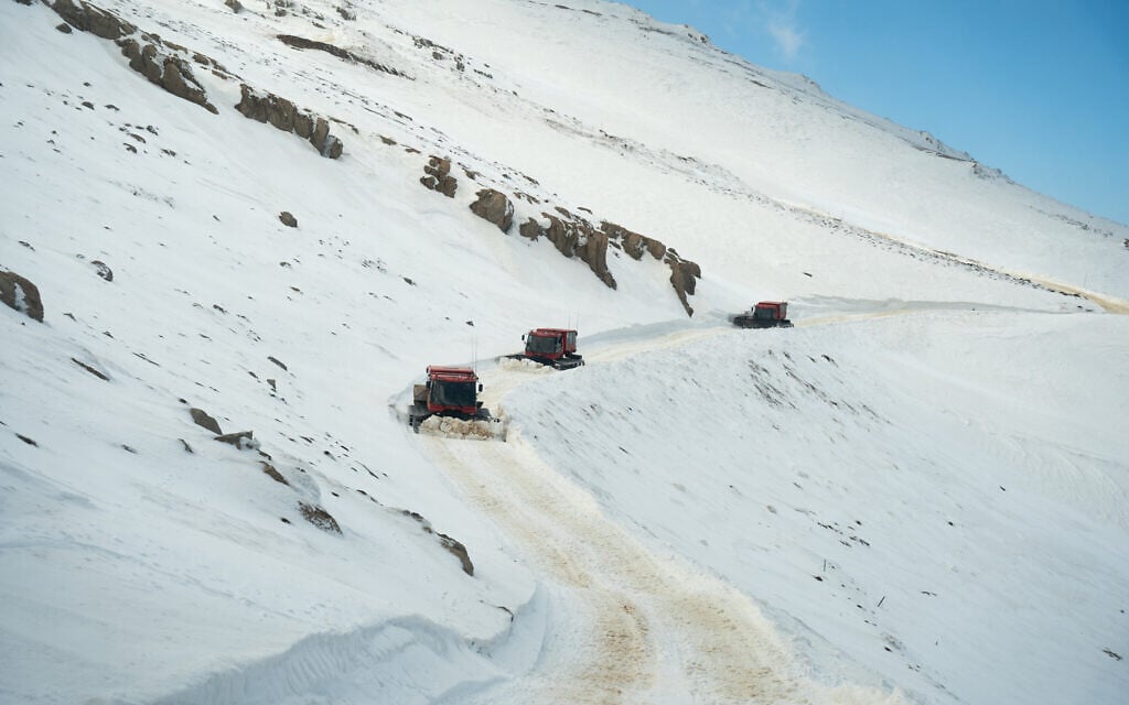 IDF snowcats drive through the Mount Hermon area in southern Syria, March 11, 2025. (Emanuel Fabian/Times of Israel)